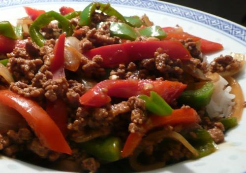 Beef Sautéed with Peppers and Onions Topped with Cheese